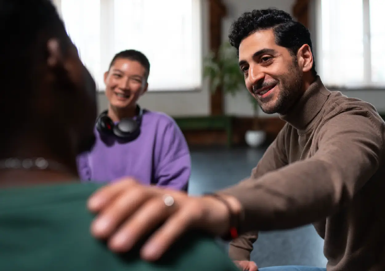 People taking part in a supportive group conversation